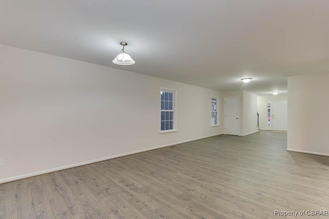 spare room featuring light hardwood / wood-style flooring