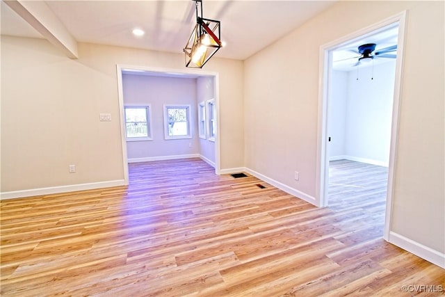 spare room featuring ceiling fan and light hardwood / wood-style flooring