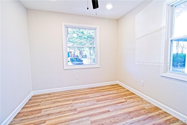 unfurnished room featuring light hardwood / wood-style floors