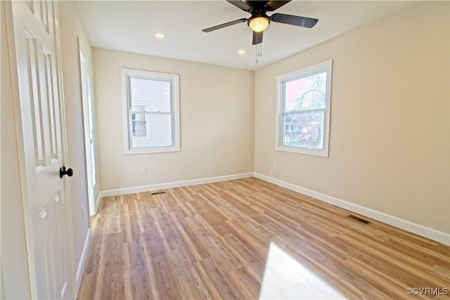 unfurnished room with light wood-type flooring and ceiling fan