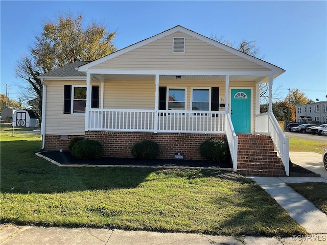 bungalow-style house with a front yard and a porch