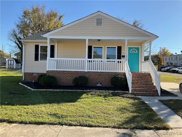 view of front facade with covered porch and a front yard