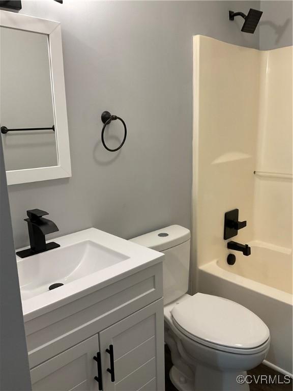 full bathroom featuring vanity, toilet, and tub / shower combination