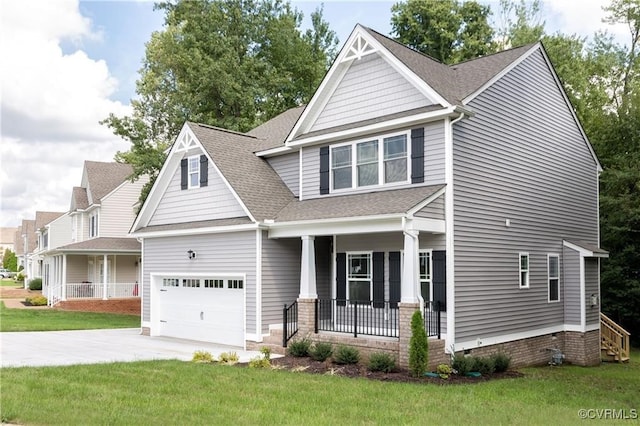 craftsman-style home with a garage, covered porch, and a front yard