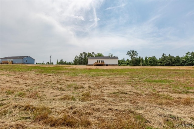 view of yard with a rural view