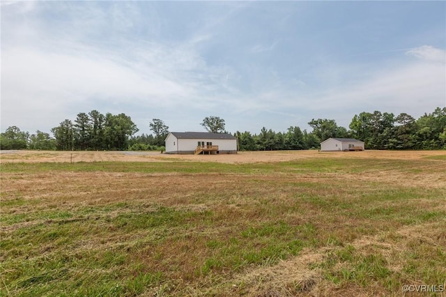 view of yard with a rural view