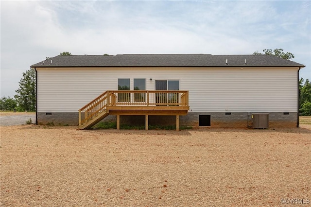 back of property featuring a wooden deck and central AC unit