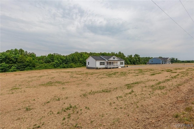 view of yard with a rural view