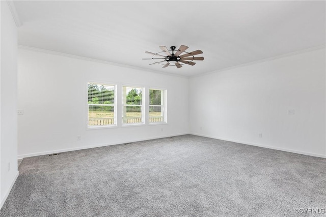 carpeted empty room featuring ceiling fan and ornamental molding