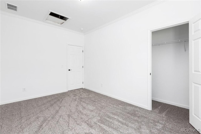 unfurnished bedroom featuring carpet, a closet, and ornamental molding