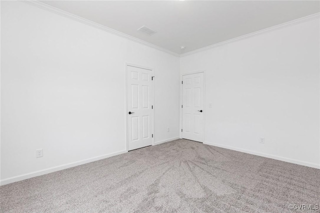 spare room with carpet floors and ornamental molding