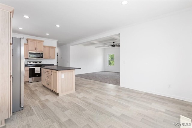 kitchen with light brown cabinets, crown molding, ceiling fan, appliances with stainless steel finishes, and a kitchen island