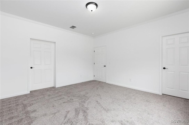 carpeted empty room with ornamental molding