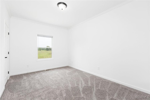 carpeted spare room with ornamental molding