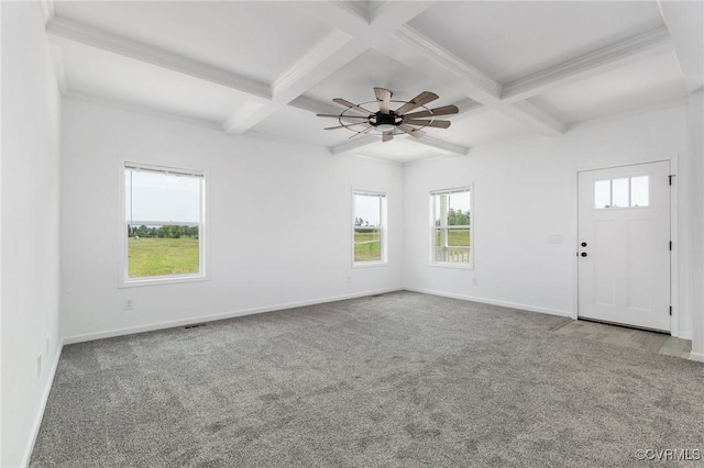 spare room featuring beamed ceiling, ceiling fan, carpet, and coffered ceiling