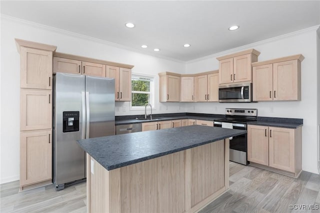 kitchen with sink, ornamental molding, light brown cabinetry, light hardwood / wood-style floors, and stainless steel appliances