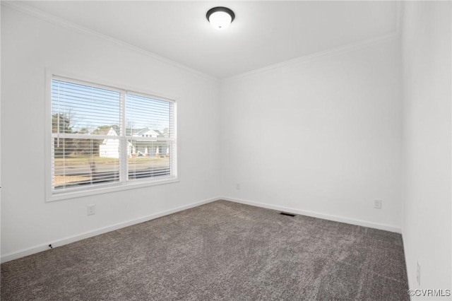 carpeted spare room with ornamental molding