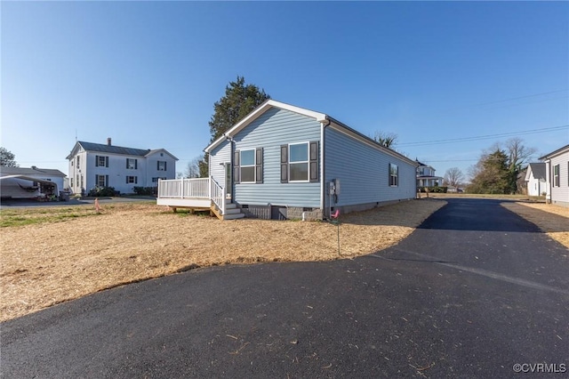 view of front of home featuring a wooden deck