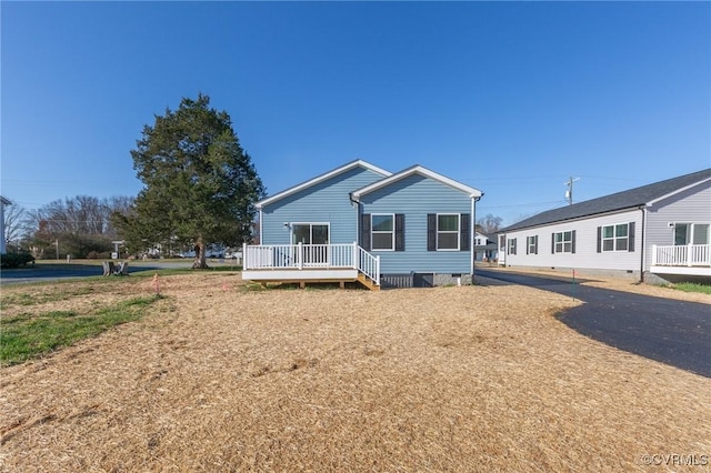 view of front of property with a deck