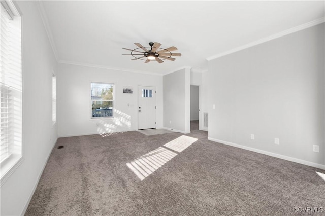 unfurnished room featuring carpet flooring, ceiling fan, and crown molding