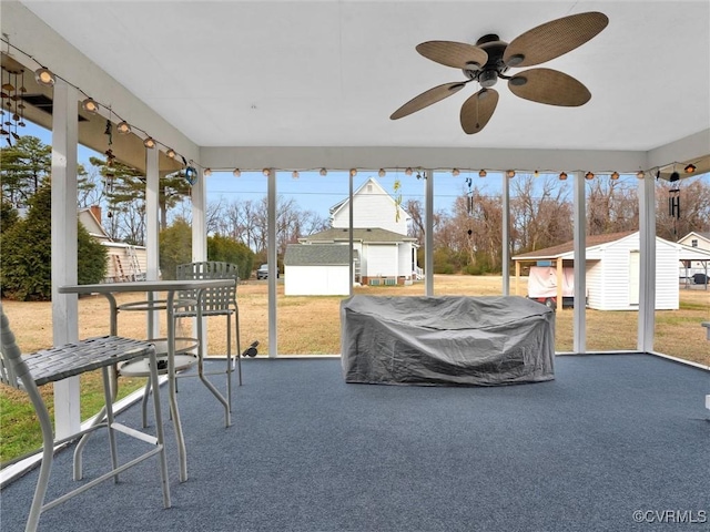 sunroom / solarium with ceiling fan