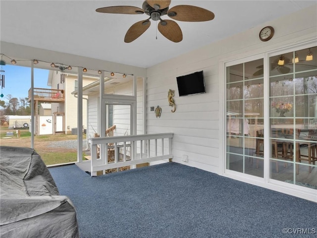 sunroom with ceiling fan and a wealth of natural light