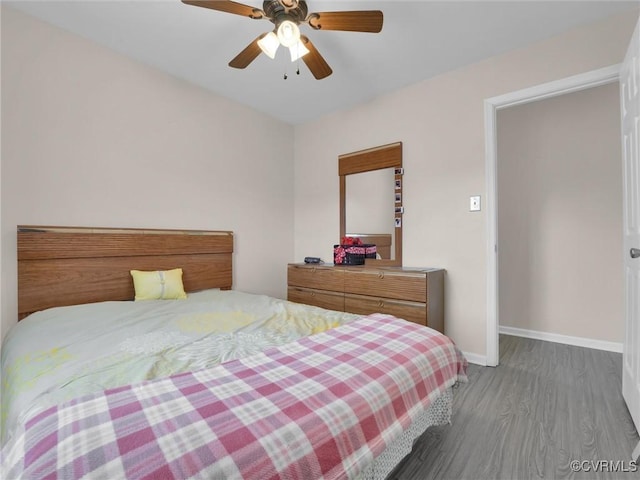 bedroom with ceiling fan and hardwood / wood-style floors