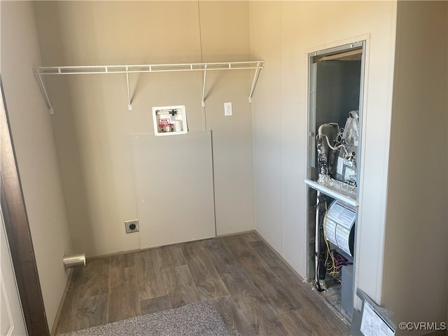 laundry area featuring hookup for a washing machine, dark hardwood / wood-style floors, and electric dryer hookup