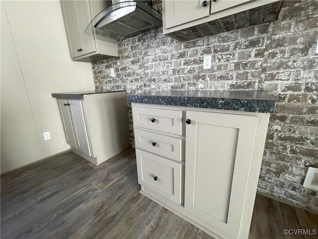 kitchen with white cabinetry, dark hardwood / wood-style floors, and ventilation hood