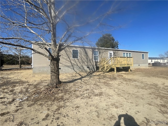 rear view of house with a deck