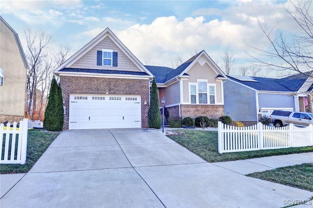 craftsman house featuring a front yard and a garage