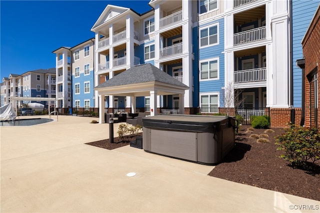 view of patio with a hot tub