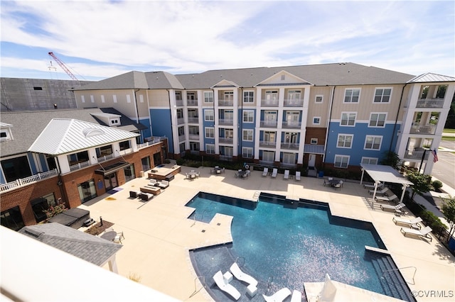 view of swimming pool with a patio