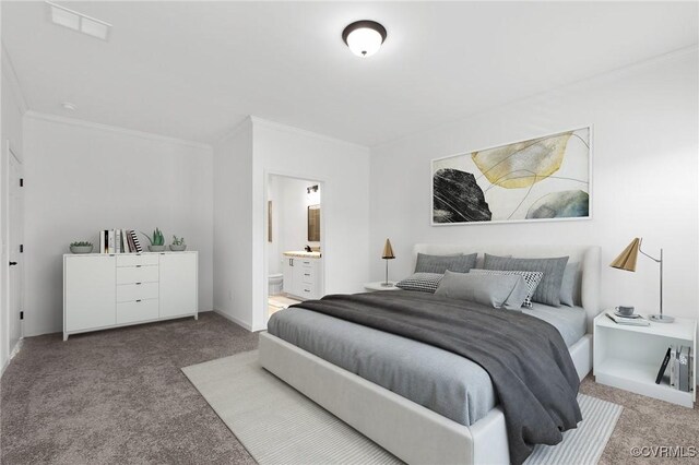 bedroom featuring carpet, crown molding, and connected bathroom