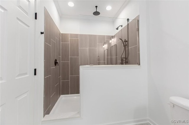 bathroom featuring toilet, walk in shower, and crown molding