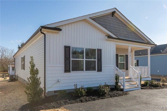 view of front of property featuring a porch and central AC unit