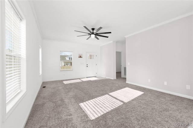 carpeted spare room with crown molding and ceiling fan