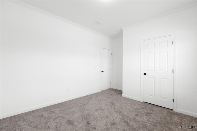 carpeted spare room with ornamental molding