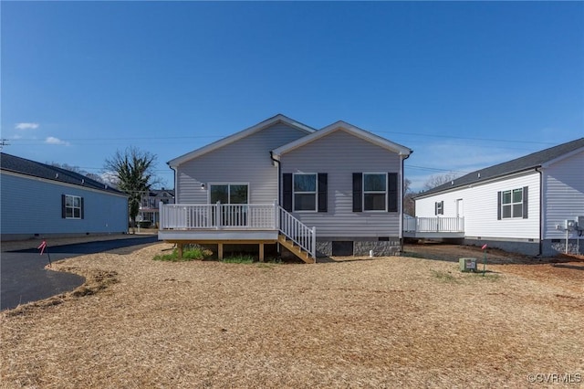 view of front of home with a wooden deck