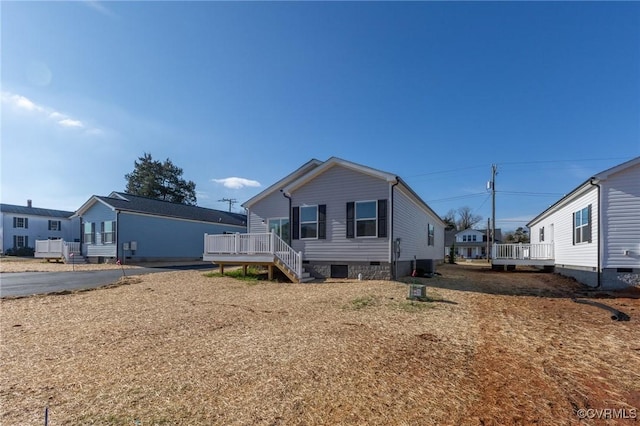 manufactured / mobile home with a wooden deck