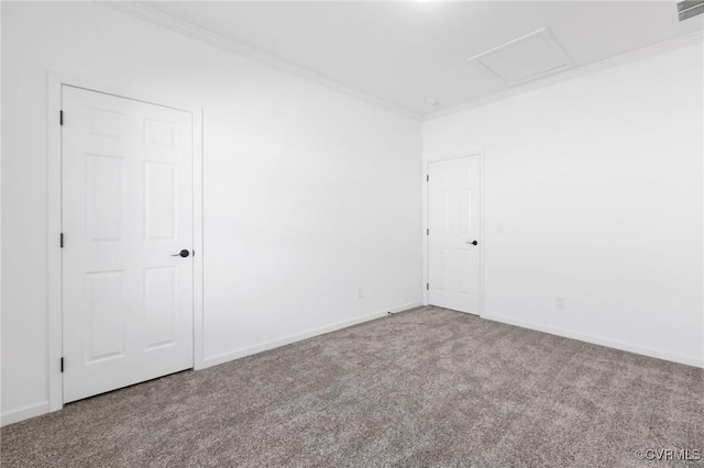 carpeted spare room featuring crown molding