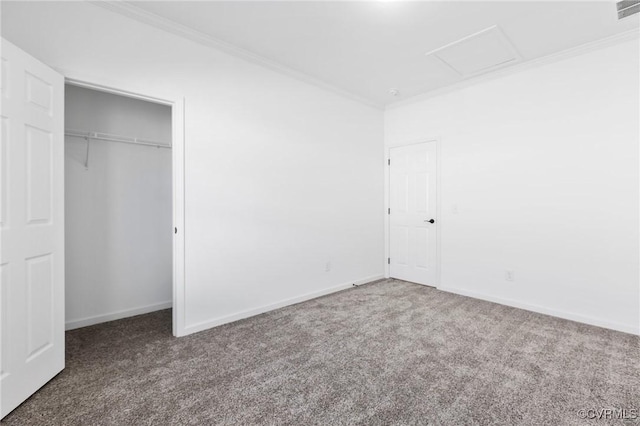 unfurnished bedroom with a closet, carpet floors, and ornamental molding