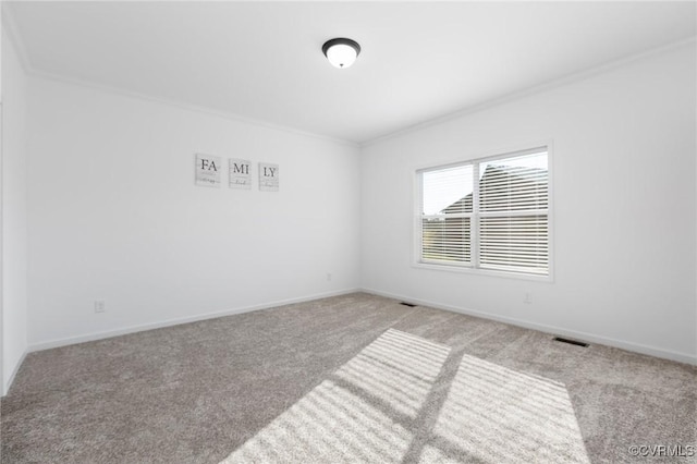 carpeted empty room featuring ornamental molding