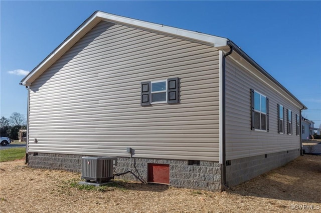 view of property exterior with central AC