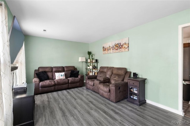 living room with dark hardwood / wood-style floors