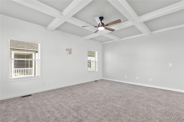 carpeted spare room with beam ceiling, ceiling fan, and coffered ceiling