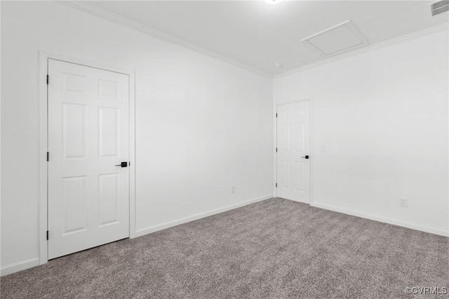 carpeted spare room featuring ornamental molding