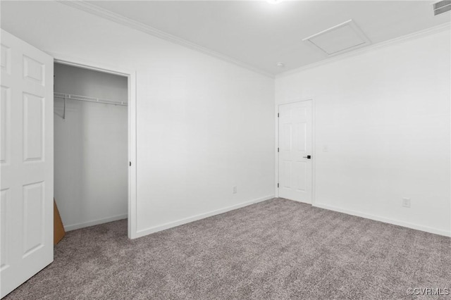 unfurnished bedroom with crown molding, a closet, and carpet flooring