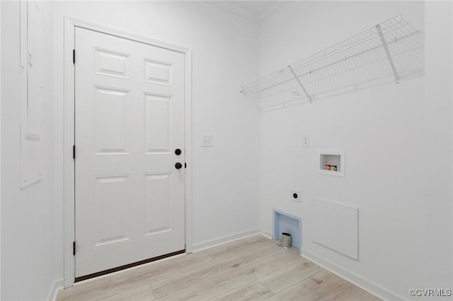 laundry area with electric dryer hookup, washer hookup, and light hardwood / wood-style floors