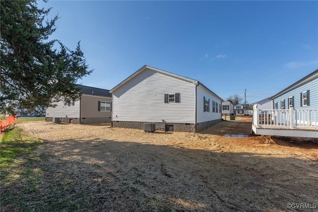 view of side of property with a deck